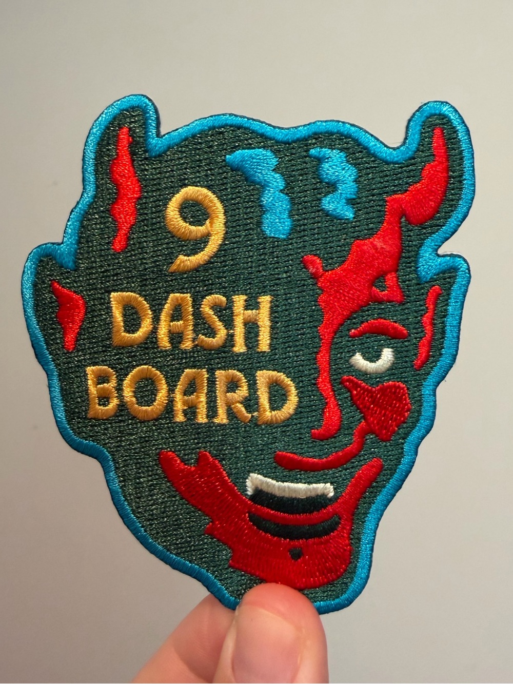 Noah Kahan - 9 ‘DASH BOARD' Embroidered Devil Face Patch - Teal, Red & Gold
